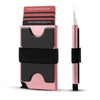 A pink and black RFID blocking metal pop-up card wallet shown next to a slender metal pen.