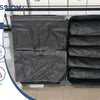A black reusable vacuum storage bag set shown open, demonstrating waterproof and odor-free storage for travel.