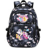 A black backpack with a floral and starry pattern featuring colorful characters.
