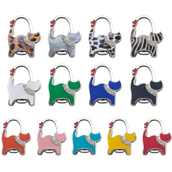 A set of portable cat handbag hooks in various animal patterns and colors for table hanging.