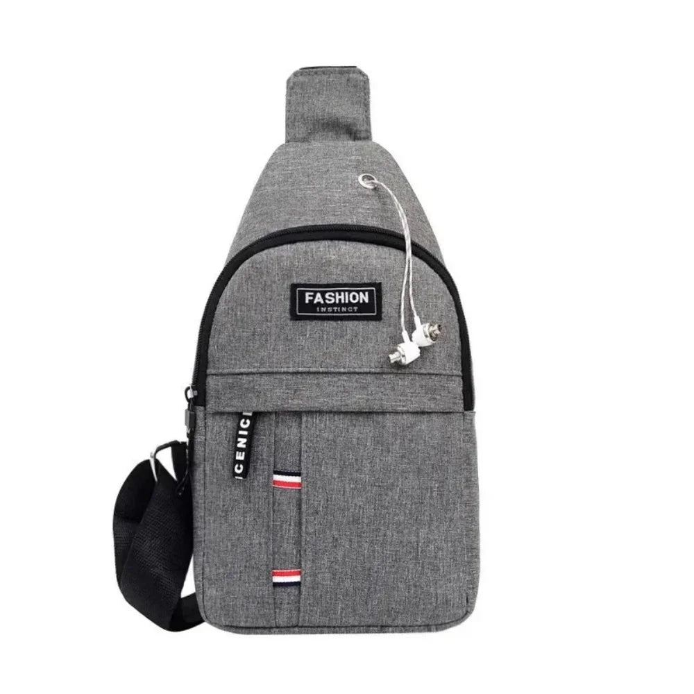 Gray men's waterproof crossbody fanny pack with a zipper pull and a red and white flag detail.