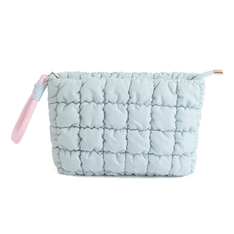 Light blue quilted puffer makeup bag with pink strap