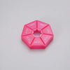 A pink weekly pill organizer divided into seven sections labeled with the days of the week.