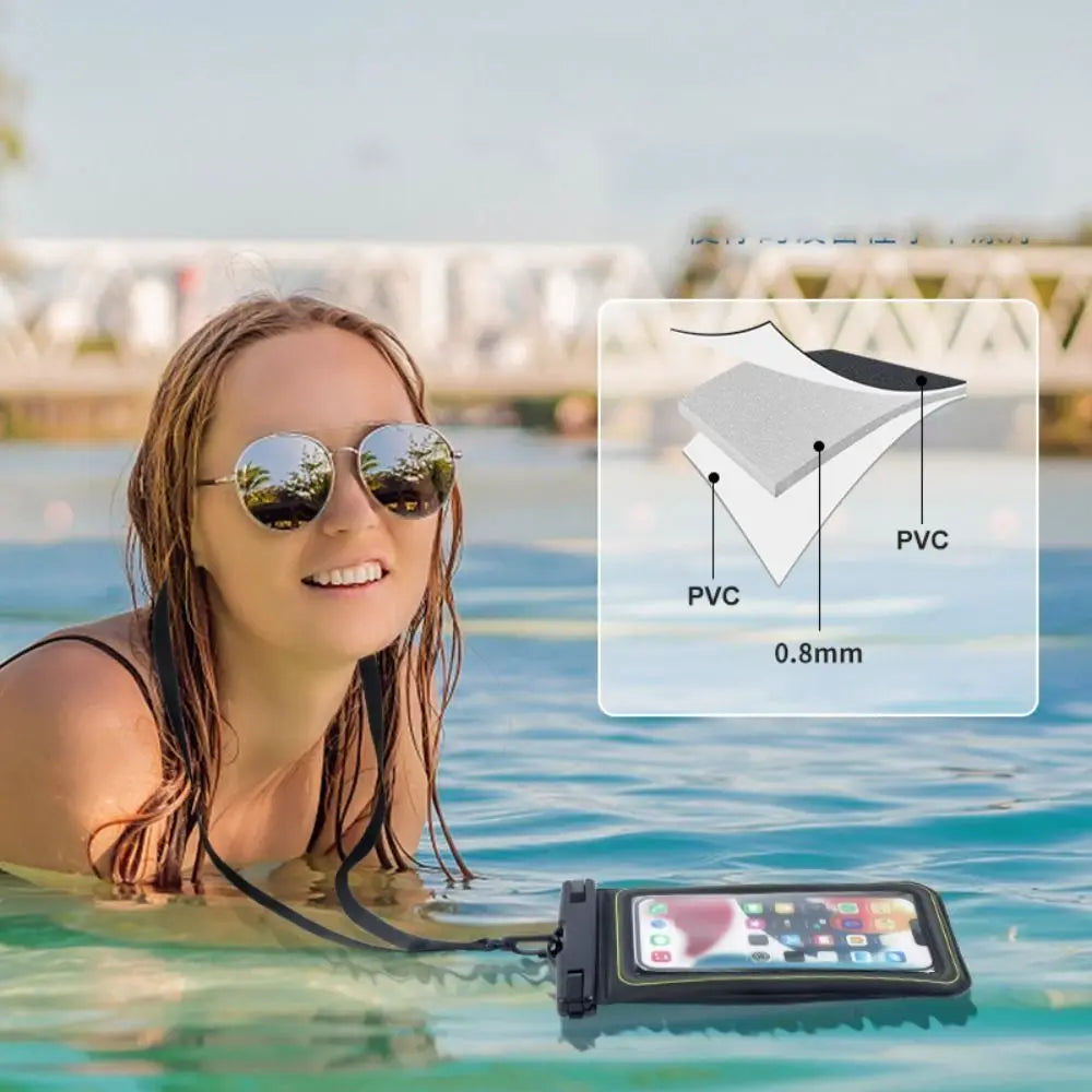 A woman wearing sunglasses is in water with a waterproof phone case floating on the surface.