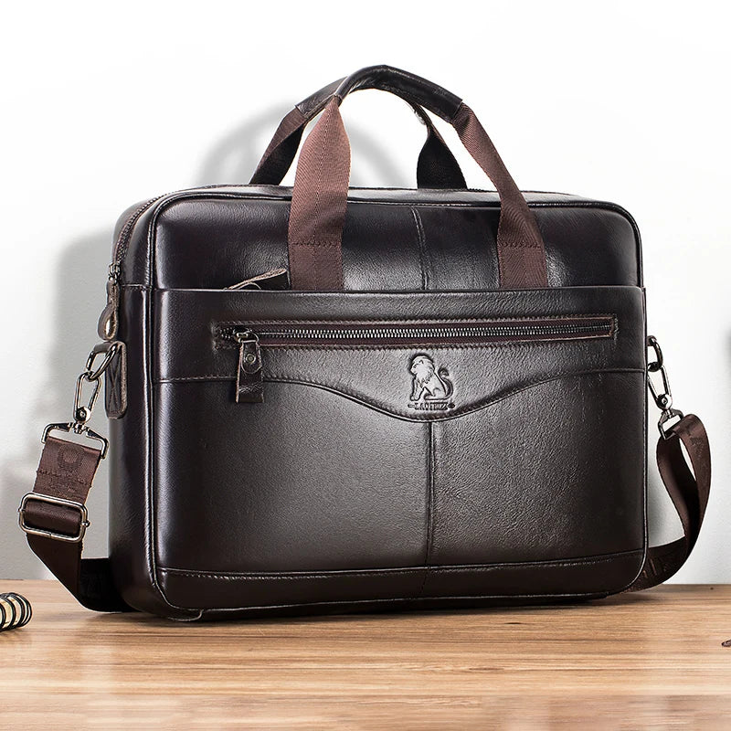 A dark brown genuine cowhide leather briefcase bag with brown leather straps and a zippered compartment.