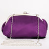 A deep purple rose floral evening clutch bag with a silver chain strap.