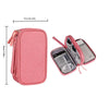 A pink portable digital accessory organizer pouch with a zipper and a separate clear sleeve inside.