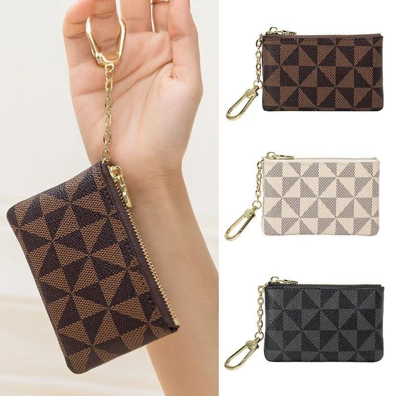 Three geometric mini coin purses in brown black beige and black leather with gold chains