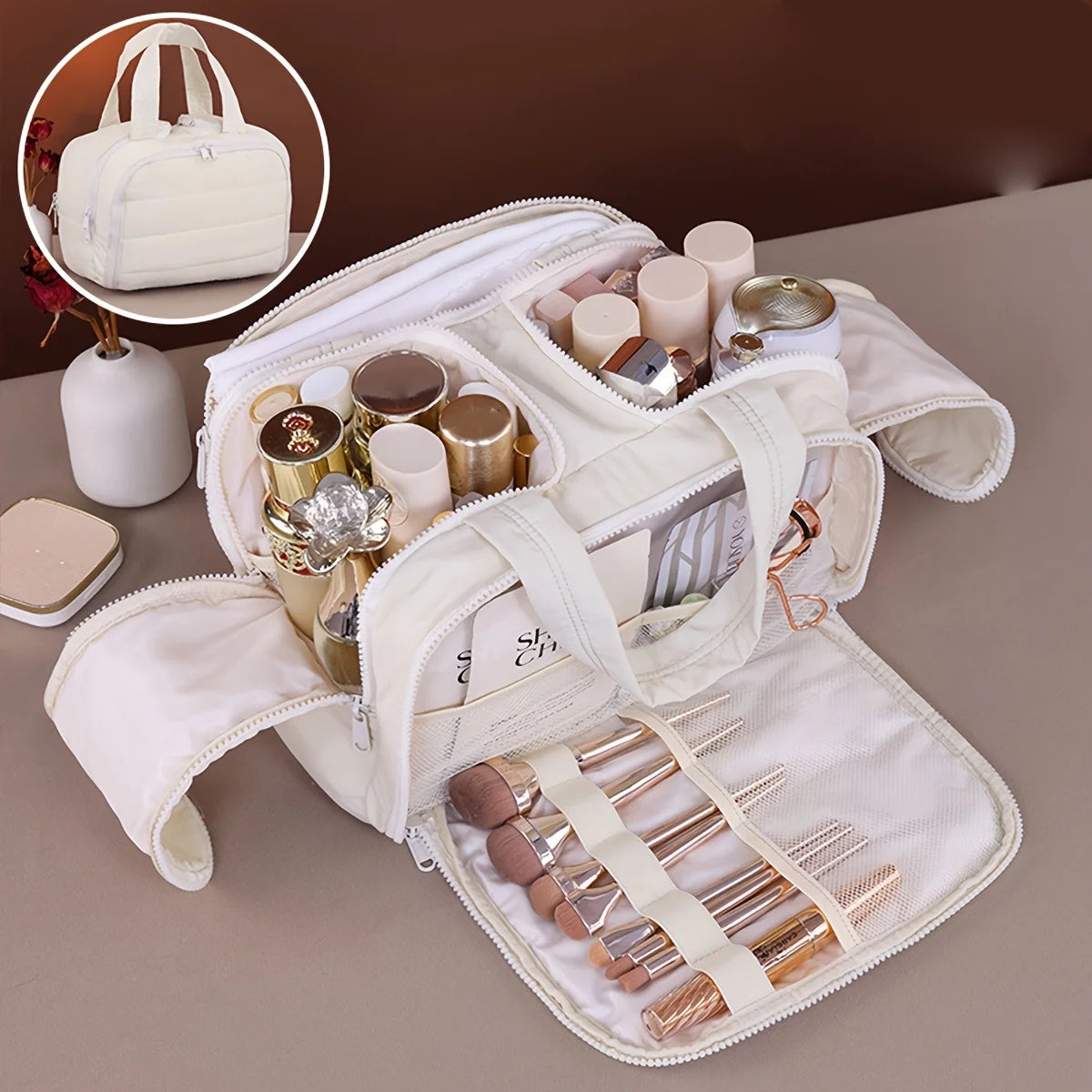 A beige portable side-zip cosmetic organizer bag with a matching handbag is shown open, displaying various makeup and jewelry