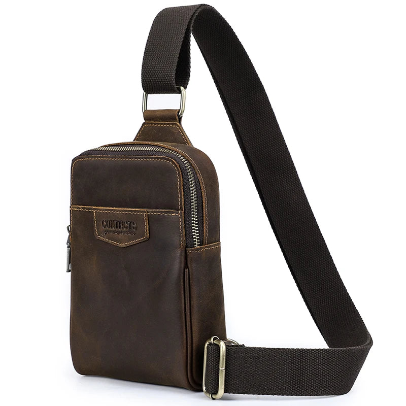 A brown genuine leather men's crossbody bag with a black adjustable strap.
