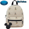 Mochila de peluche de ratón pato de color crema con correa negra y bolsillo con cremallera.