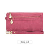 A pink retro long wallet with a gold zipper pull and a matching pink strap.