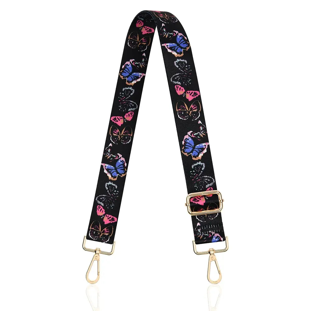 Black nylon crossbody bag strap with pink and blue butterfly print and gold hardware