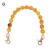 Handcrafted resin stone bead bag chain with round amber and orange colored beads