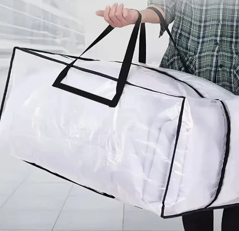 A person is holding a white heavy duty storage bag with black handles and a clear plastic lining.