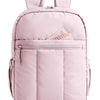 A light pink large capacity laptop backpack with quilted detailing and a zipper pocket.