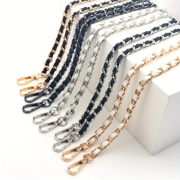 A collection of adjustable metal crossbody purse straps in black, silver, and gold tones laid out on a white surface.