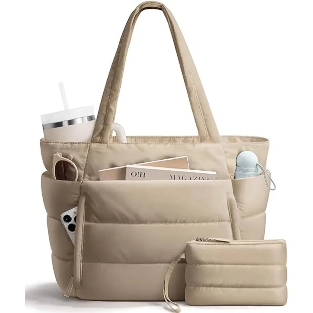 A beige quilted puffer tote bag with pockets and a matching pouch resting on a white surface.