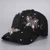 Black mesh snapback baseball cap decorated with sparkling floral embroidery