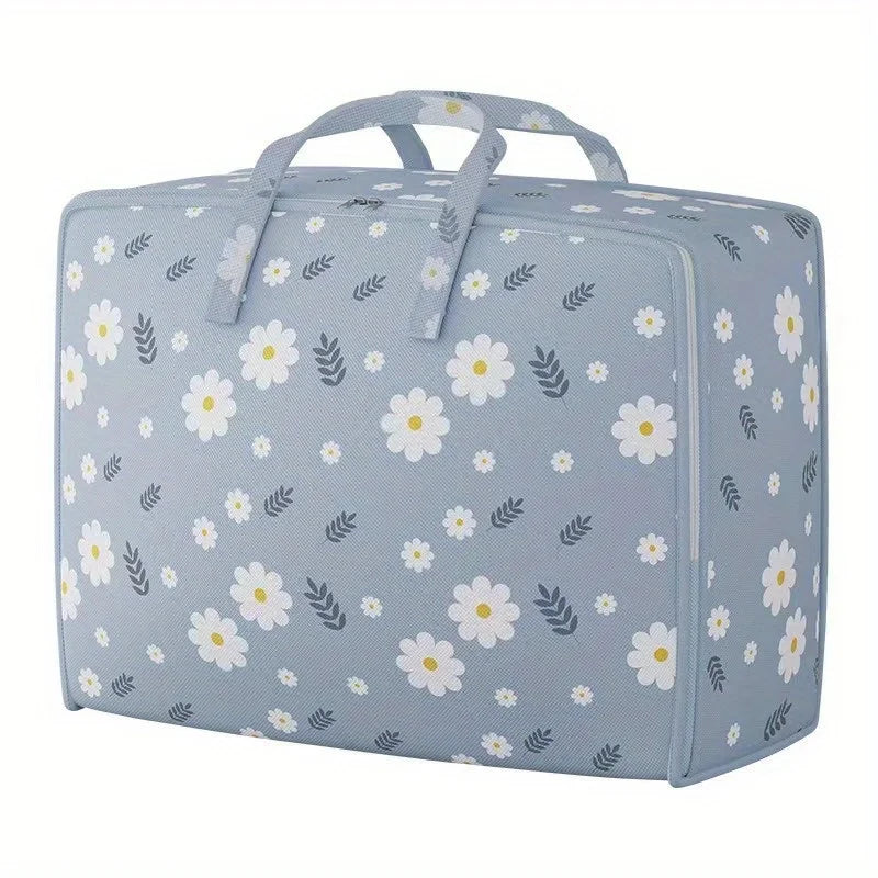 Light blue fabric storage bags with a white floral pattern, designed for storing blankets and clothes.