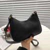 A black retro solid color PU leather shoulder bag with a strap is shown against a white background.