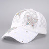 White mesh snapback baseball cap decorated with sparkling floral embroidery