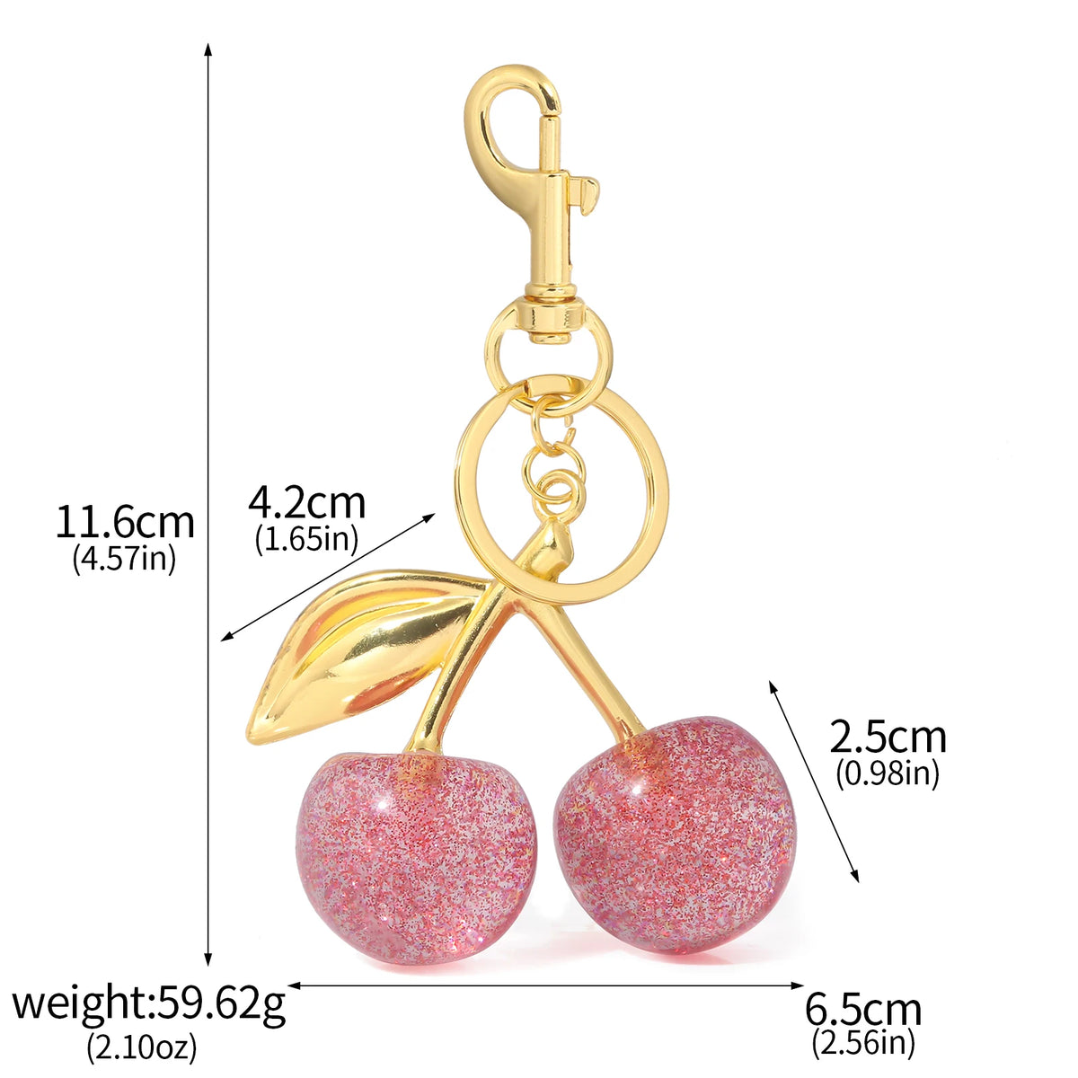 A gold-colored keychain featuring a pink crystal cherry fruit charm.