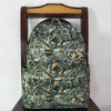 A dark green and black camouflage patterned toddler backpack displayed on a wooden hanger.