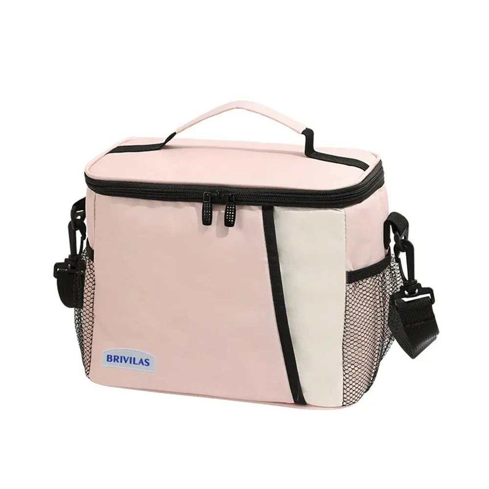 Pink and white insulated reusable lunch bag with a black strap.