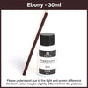 Une bouteille d'huile de peinture cuir Ebony 30ml avec un bâtonnet applicateur en bois.