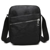 Black waterproof PU leather sling bag with a zippered pocket and adjustable strap.