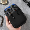 A hand holds a black organizer pouch with blue and black tools inside, set against a gray background.