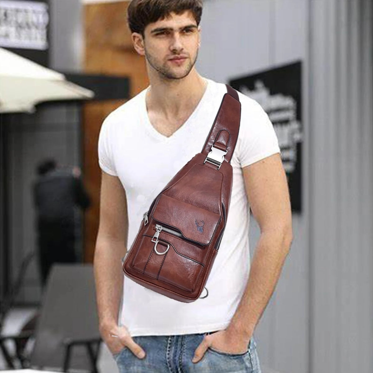 A man wearing a white shirt holds a brown PU leather crossbody sling bag.