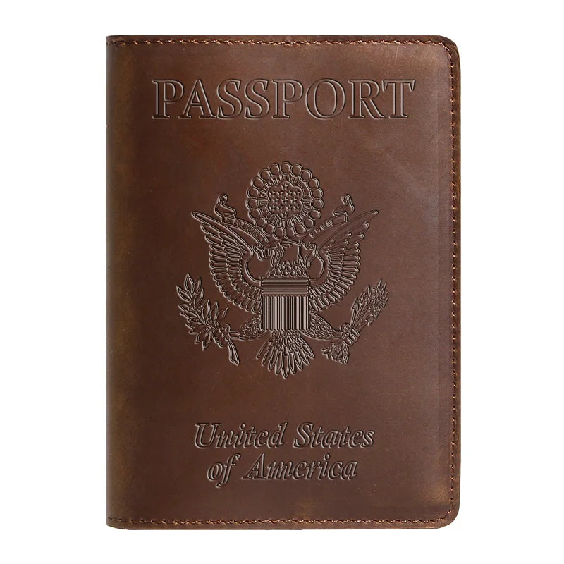 A brown leather passport holder embossed with the words PASSPORT and the seal of the United States of America