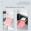 Pink silicone reusable sandwich container shown in a microwave and refrigerator safe context.