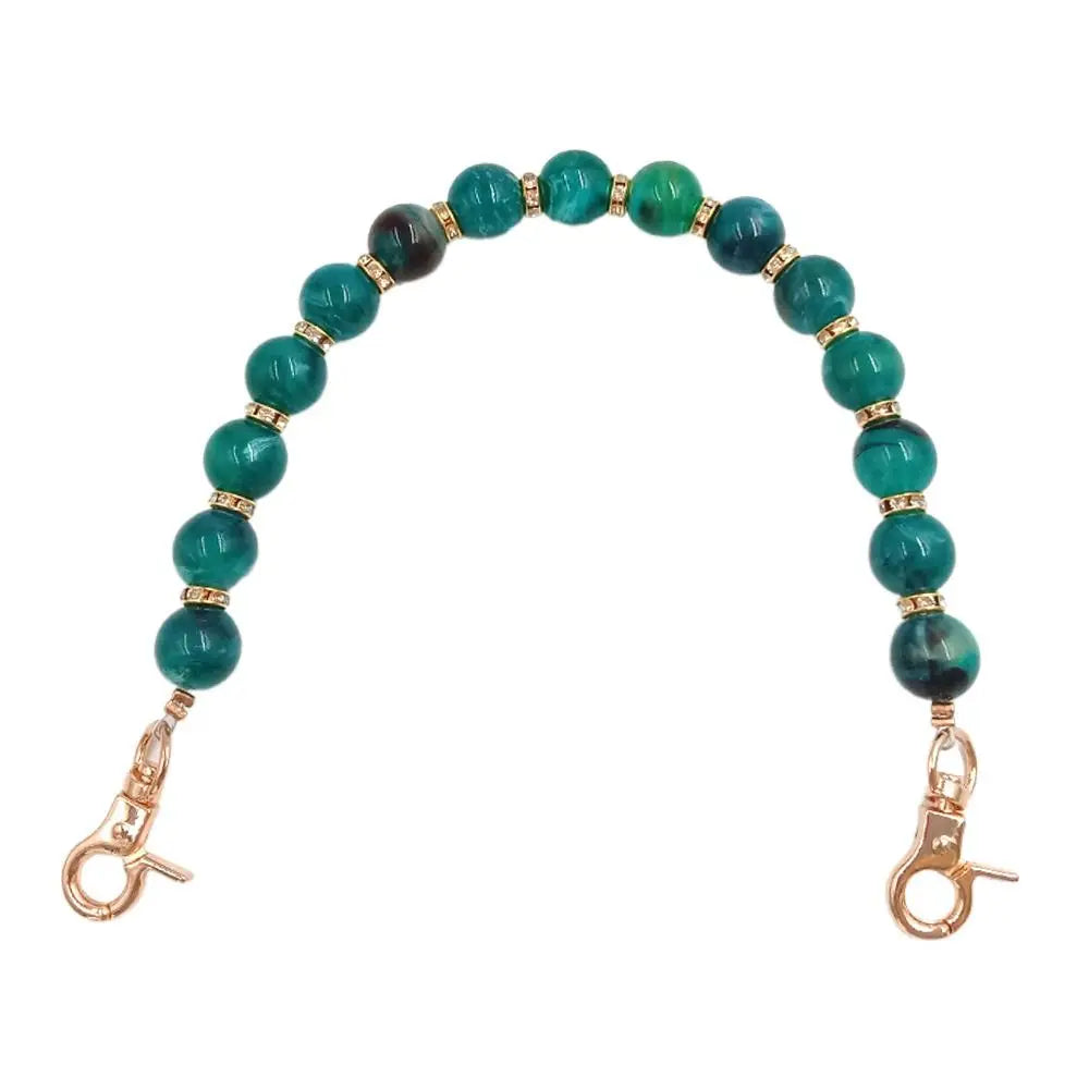 Handcrafted resin stone bead bag chain featuring green and blue beads.
