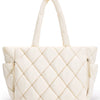 A cream quilted puffy tote bag with a handle and zipper detail.
