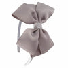 A light beige striped fabric bow headband is shown against a white background.