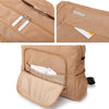A tan corduroy diaper backpack showing close-ups of the zipper and interior pocket details.