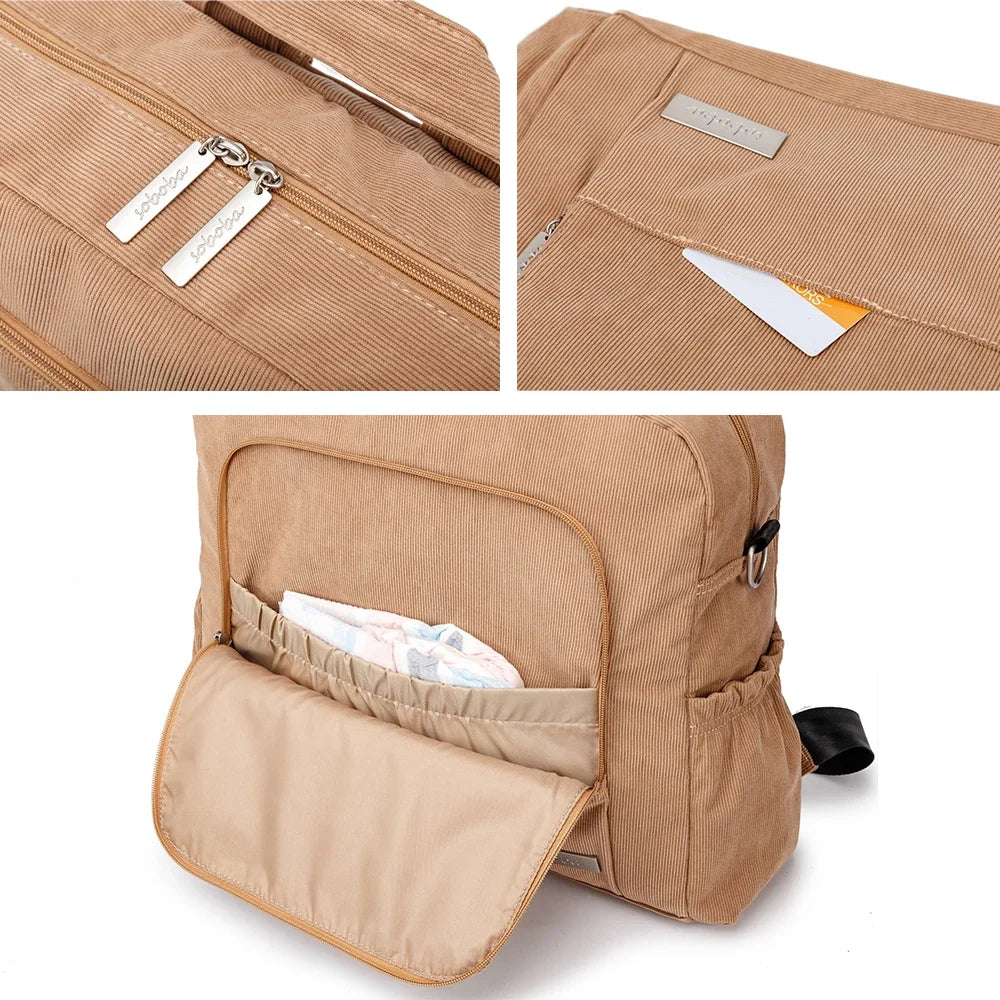 A tan corduroy diaper backpack showing close-ups of the zipper and interior pocket details.