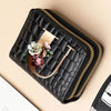 Black quilted PU leather clutch wallet with gold accents and a floral print
