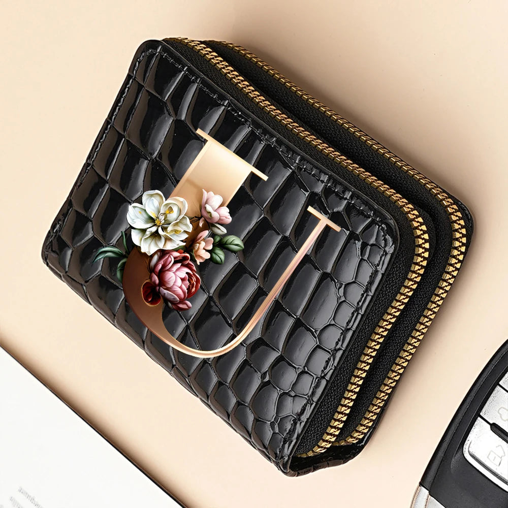 Black quilted PU leather clutch wallet with gold accents and a floral print