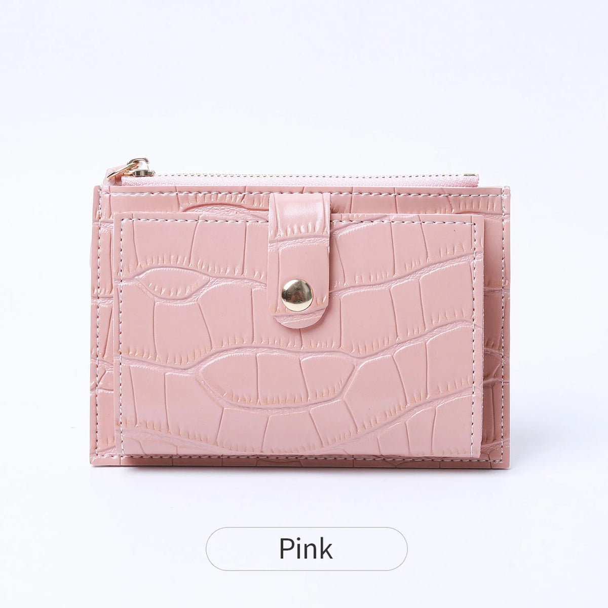 A pink mini crocodile pattern leather card holder with a zipper closure.