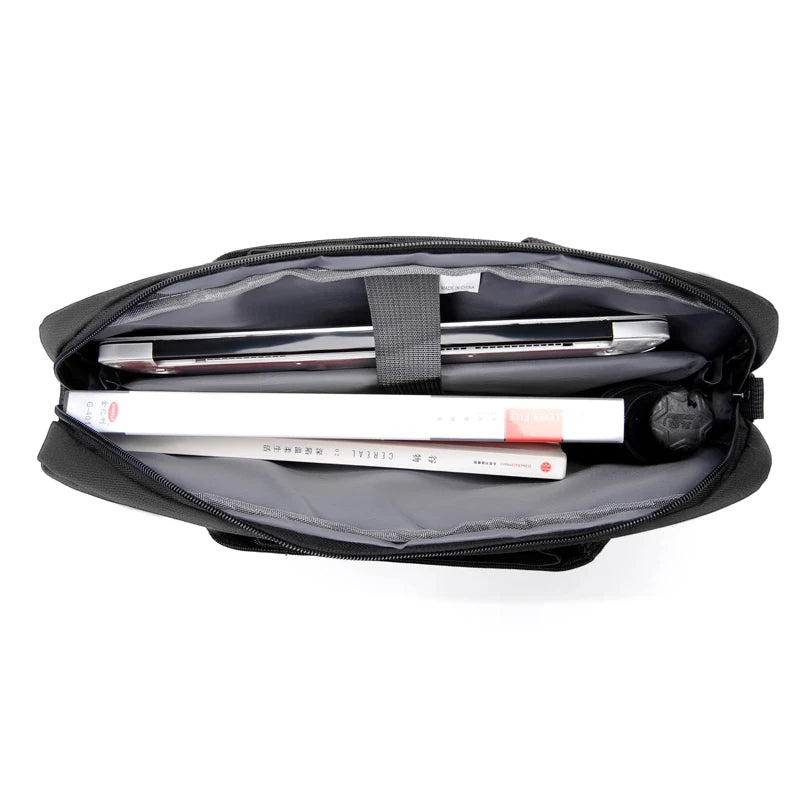 Black slim commuter laptop briefcase with a padded interior and a laptop inside.