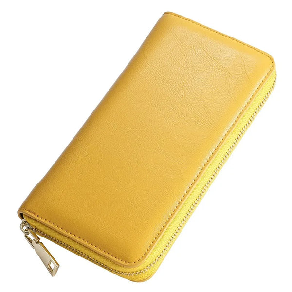 A yellow genuine leather zipper wallet shown from above.