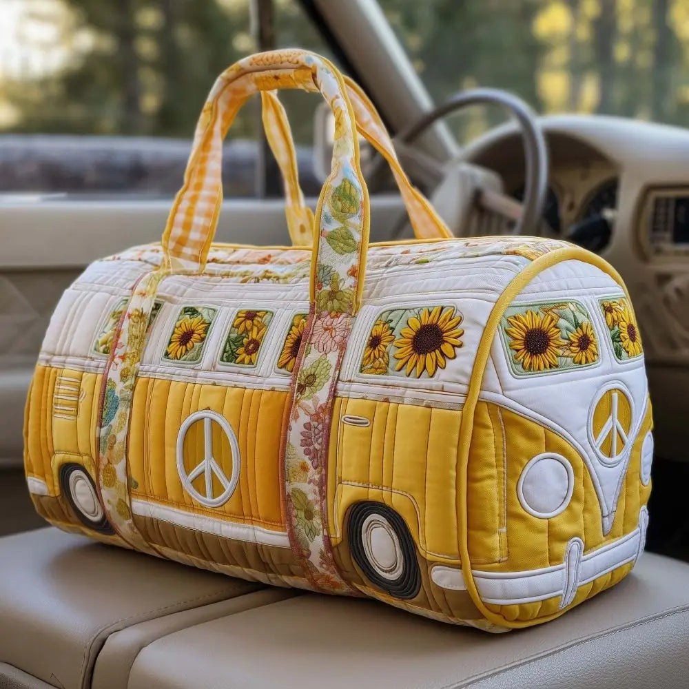 A yellow quilted travel duffle bag shaped like a vintage bus with sunflower and peace sign designs.