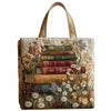 Bolso de tela acolchado vintage con una pila vertical de libros viejos y bordado floral sobre fondo crema.