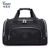 Black durable nylon travel duffle bag with zippered compartments and carrying handles