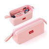 Pink minimalist large capacity pencil case with a label holder and various stationery items inside