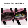 Pink nylon shoulder tote bag showing internal structure and capacity with various items inside
